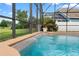 Sparkling screened-in pool featuring water jets offers a refreshing spot for outdoor fun and relaxation at 12543 Waterhaven Cir, Orlando, FL 32828
