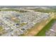 Expansive aerial shot of a residential neighborhood showcasing well-maintained homes and landscaped streets at 1312 Sugarwood St, Davenport, FL 33837