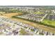 Beautiful aerial view showcasing a desirable home with lush landscaping in a well-planned community at 1312 Sugarwood St, Davenport, FL 33837