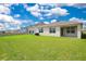 Large green backyard, perfect for outdoor activities at 1312 Sugarwood St, Davenport, FL 33837