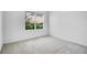 Bedroom with natural light and carpet flooring at 1312 Sugarwood St, Davenport, FL 33837