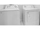 Bright laundry room featuring white appliances at 1312 Sugarwood St, Davenport, FL 33837