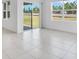 Bright and spacious living room with tiled floors and sliding glass doors at 1312 Sugarwood St, Davenport, FL 33837