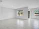 Bright and spacious living room with tiled floors and large windows offering natural light at 1312 Sugarwood St, Davenport, FL 33837