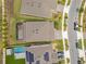 Aerial shot of backyard, showcasing screened lanai and rectangular pool at 13330 Panama Beach Ct, Orlando, FL 32827