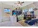 Bedroom featuring a unique four poster canopy bed and large windows with plenty of light at 13330 Panama Beach Ct, Orlando, FL 32827