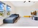Large bonus room featuring a comfortable couch, and a TV at 13330 Panama Beach Ct, Orlando, FL 32827