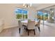 Bright dining area with a round table, comfortable chairs, and a view of the outdoor patio, perfect for casual meals at 13330 Panama Beach Ct, Orlando, FL 32827