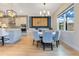 Elegant dining area with modern lighting, stylish wall art, and a view of the kitchen, perfect for entertaining at 13330 Panama Beach Ct, Orlando, FL 32827