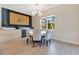 Cozy dining room featuring a round table, elegant chairs, and a modern buffet, creating a welcoming atmosphere at 13330 Panama Beach Ct, Orlando, FL 32827