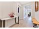 Home Foyer features a wood bench, console table and tile flooring at 13330 Panama Beach Ct, Orlando, FL 32827