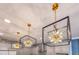 Stunning kitchen lighting featuring geometric pendant lights over the island at 13330 Panama Beach Ct, Orlando, FL 32827