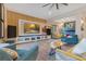 Spacious living room with a large tv, stylish furniture, and natural light at 13330 Panama Beach Ct, Orlando, FL 32827