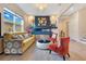 Cozy living room featuring an electric fireplace, stylish decor, and comfortable seating at 13330 Panama Beach Ct, Orlando, FL 32827