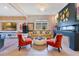 Bright living room featuring an electric fireplace, stylish decor, and an elegant chandelier at 13330 Panama Beach Ct, Orlando, FL 32827