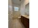Tile bathroom features a shower-tub combo, toilet, and sink with vanity at 1432 Stargazer Ter, Sanford, FL 32771