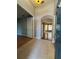 Inviting foyer with tile flooring, arched doorway, and neutral paint at 1432 Stargazer Ter, Sanford, FL 32771