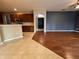 Open floor plan featuring kitchen and living space with hardwood floors at 1432 Stargazer Ter, Sanford, FL 32771