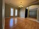 Bright living room with hardwood floors, crown molding, and window shutters at 1432 Stargazer Ter, Sanford, FL 32771