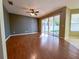 Open living area with hardwood floors and sliding glass doors to the patio at 1432 Stargazer Ter, Sanford, FL 32771