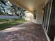 Brick patio overlooks a green lawn and white fence at 1432 Stargazer Ter, Sanford, FL 32771