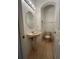 Small powder room with pedestal sink, toilet, and tiled floor at 1432 Stargazer Ter, Sanford, FL 32771
