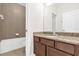 Bathroom with tile flooring, vanity, and a shower-tub combination at 16780 Meadows St, Clermont, FL 34714