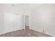 Cozy bedroom with carpeted floors and a closet, perfect for relaxation and storage at 16780 Meadows St, Clermont, FL 34714