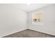 A simply appointed bedroom with neutral carpet and a window at 16780 Meadows St, Clermont, FL 34714