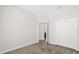 Bedroom includes carpet, closet and an open door to another room at 16780 Meadows St, Clermont, FL 34714
