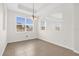 Open dining room with tile flooring, a modern chandelier, and natural light at 16780 Meadows St, Clermont, FL 34714