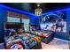 Fun bedroom with star-themed ceiling, themed bedding and walls, and accent lighting at 1820 Summer Dr, Davenport, FL 33897