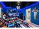 Themed bedroom with star ceiling, muraled walls, bedding, and decor plus an en suite bathroom at 1820 Summer Dr, Davenport, FL 33897