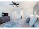 Bedroom featuring a large bed, neutral tones and textures, and ensuite bathroom at 1820 Summer Dr, Davenport, FL 33897