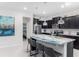 Kitchen with granite countertops, stainless steel appliances, dark brown cabinetry, and bar stool seating at 1820 Summer Dr, Davenport, FL 33897