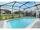 Enjoy backyard privacy with this screened-in pool and beautiful landscaping at 1820 Summer Dr, Davenport, FL 33897