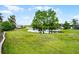 A lush, well-maintained backyard with a serene pond view, perfect for relaxation and outdoor activities at 212 Tavestock Loop, Winter Springs, FL 32708