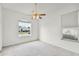 Inviting bedroom featuring a ceiling fan and large window offering an exterior view at 212 Tavestock Loop, Winter Springs, FL 32708