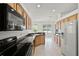 Kitchen featuring a large window, ample countertop space, and modern appliances at 212 Tavestock Loop, Winter Springs, FL 32708