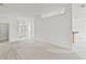 Bright, open-concept living area with carpeted and tiled flooring, and fresh white paint at 212 Tavestock Loop, Winter Springs, FL 32708
