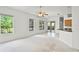 Bright living room with neutral colors, ceiling fan, and sliding doors to the outdoor patio at 212 Tavestock Loop, Winter Springs, FL 32708