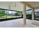 A spacious screened porch with ceiling fan offers a tranquil outdoor living space with scenic backyard views at 212 Tavestock Loop, Winter Springs, FL 32708