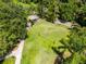 Aerial view of a volleyball court and picnic area surrounded by lush greenery in a community park at 212 Tavestock Loop, Winter Springs, FL 32708