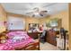 Cozy bedroom with ample natural light and a pink-themed decor at 2213 Bates Ave, Eustis, FL 32726
