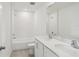 This bright bathroom features double sinks, a tiled shower and tub at 2467 Zuni Road, St Cloud, FL 34771