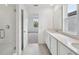 Bright bathroom with a glass shower and double vanity at 2467 Zuni Road, St Cloud, FL 34771