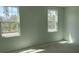 Bright bedroom with two windows offering natural light and views at 2467 Zuni Road, St Cloud, FL 34771