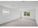 Bright and spacious bedroom with large windows and plush carpeting at 2467 Zuni Road, St Cloud, FL 34771