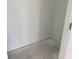 A small closet space featuring white walls and a neutral floor at 2467 Zuni Road, St Cloud, FL 34771