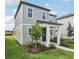 Charming two-story home with gray siding, well-manicured landscaping, and inviting front entrance at 2467 Zuni Road, St Cloud, FL 34771